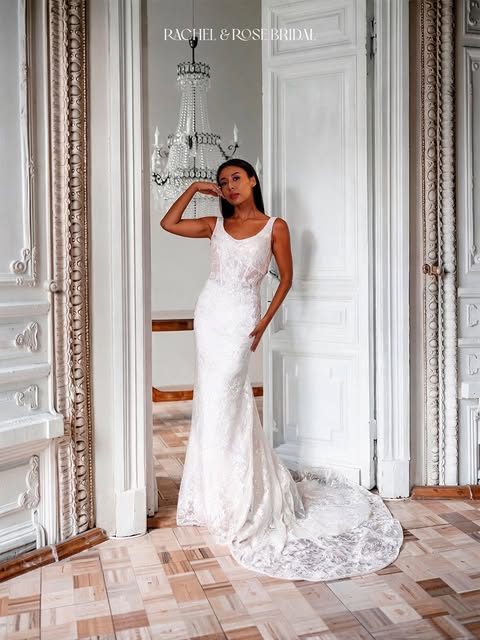 Bride in a lace gown looking back over her shoulder