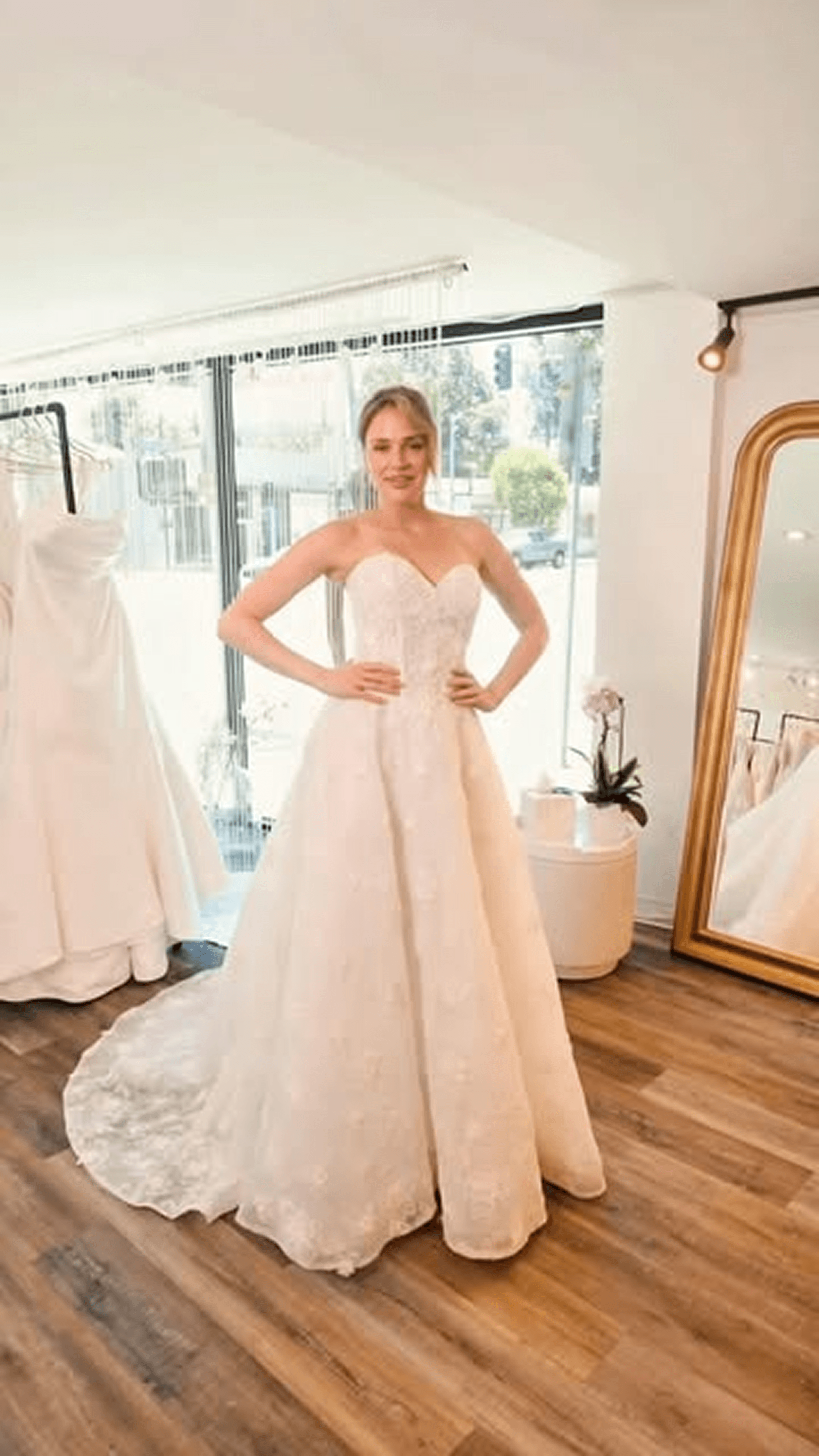 Try-on Reel cover of a bride smiling in the fitting room